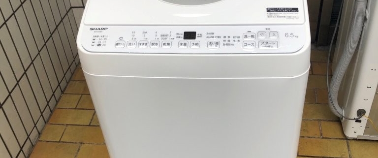 シャープ縦型洗濯機 ES-TX6H の正面全体。操作パネルとWASH＆DRYロゴが見える外観写真